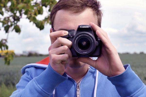 Image of man with DSLR camera