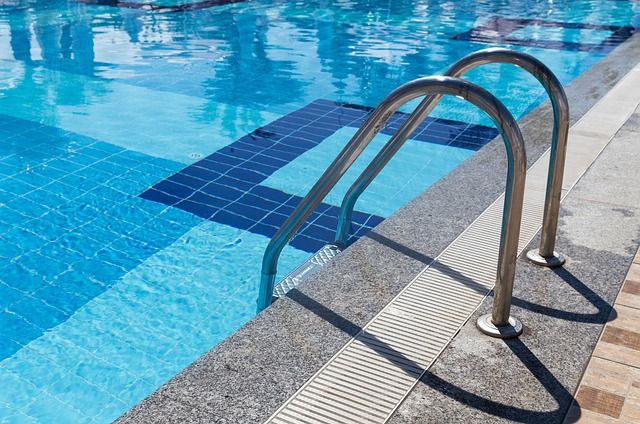 photo showing corner of a swimming pool - good tip check license and operating correctly